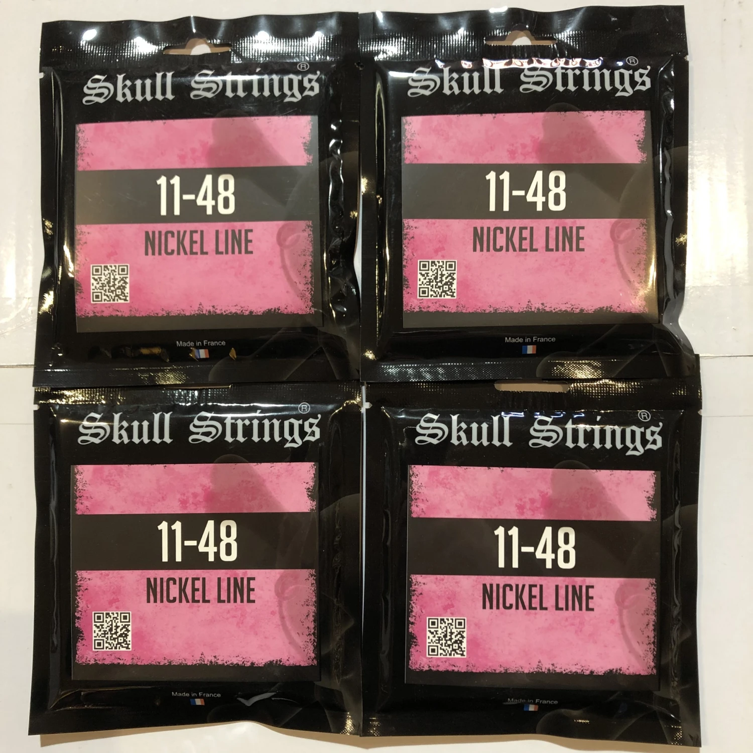 Skull Strings Nickel Line Standard Electric Guitar Strings 11-48 4 SETS 1 Skull Strings Nickel Line Standard Electric Guitar Strings 11-48 4 SETS