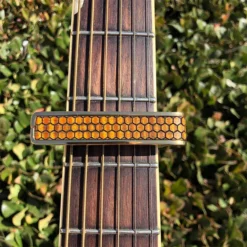 Thalia Premium Capo AAA Curly Hawaiian Koa Save The Bees Honeycomb (24K Gold) -Guitar Music Store da th cg202 04 capo premium aaa curly hawaiian save bees honeycomb gold 03